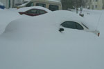 [ Snow drifts over Laura's car ]