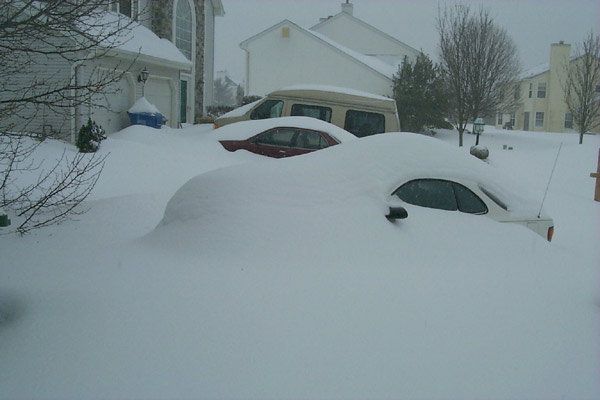 Snow drifts practically covering Laura's Celica