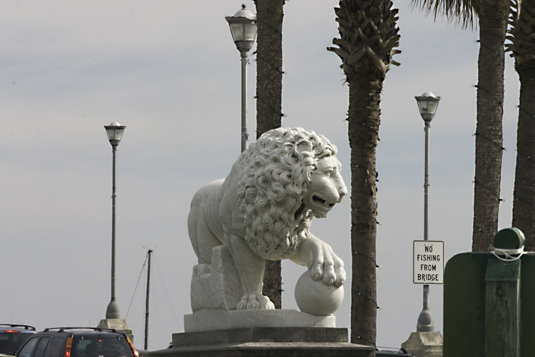 One of the lions at the Bridge of Lions